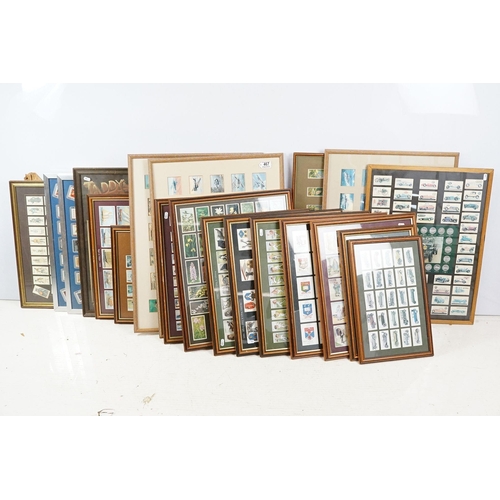 467 - Collection of framed cigarette and trade cards covering various brands and subjects to include Wills... 