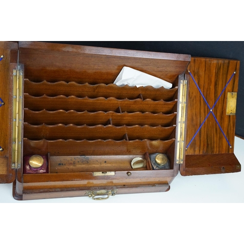 168 - 19th Century walnut writing box having a sloped twin door top opening to reveal letter rack within w... 