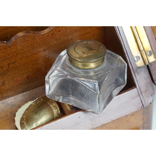 168 - 19th Century walnut writing box having a sloped twin door top opening to reveal letter rack within w... 