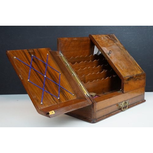 168 - 19th Century walnut writing box having a sloped twin door top opening to reveal letter rack within w... 