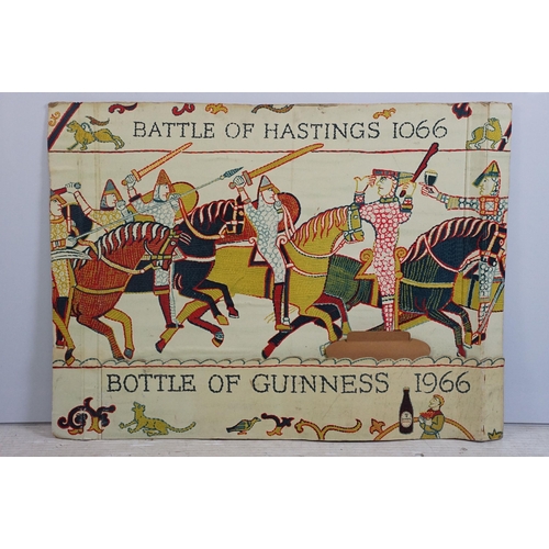 170 - Vintage Guinness advertising board printed with the Bayeux tapestry holding Guinness glasses, marked... 