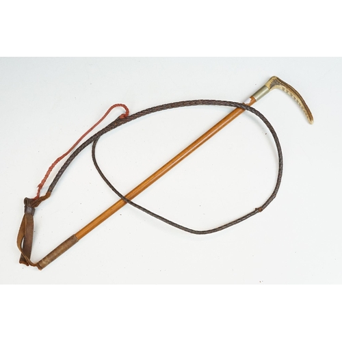 278 - A collection of eleven vintage riding crops to include leather, bamboo and wooden examples with vari... 