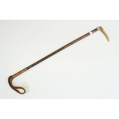 278 - A collection of eleven vintage riding crops to include leather, bamboo and wooden examples with vari... 