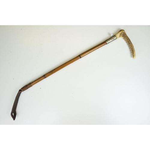 278 - A collection of eleven vintage riding crops to include leather, bamboo and wooden examples with vari... 