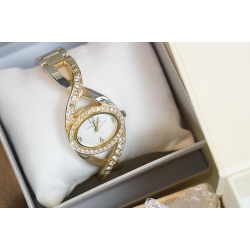 279 - A collection of contemporary ladies dress / fashion watches, many within original gift and display b... 