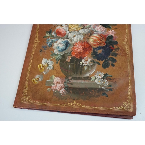 283 - An early 20th century hand painted leather folder / folio with floral decoration, measures approx 44... 