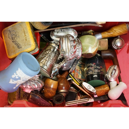 290 - A collection of mixed smoking related collectables to include tobacco pipes, tobacco tins, table lig... 