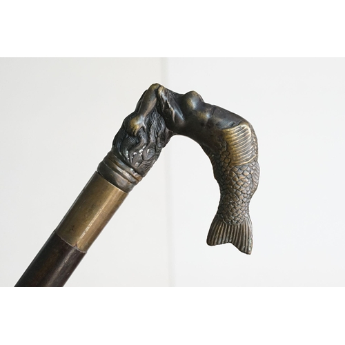 295 - A vintage walking stick with cast brass Mermaid handle and brass fittings.