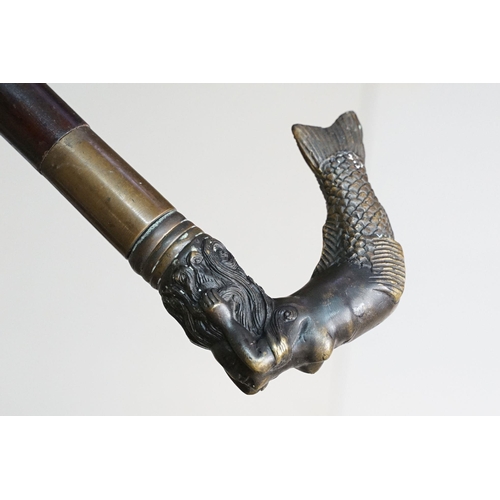 295 - A vintage walking stick with cast brass Mermaid handle and brass fittings.