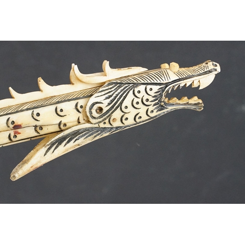 311 - Chinese carved bone dragon form dart gun