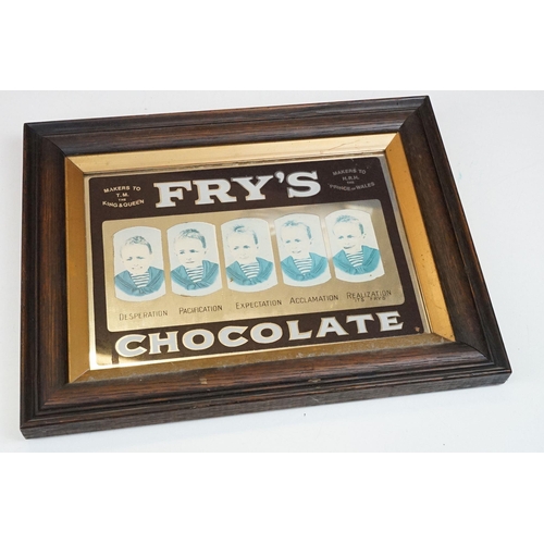 313 - A Fry's Chocolate advertising mirror within wooden frame, measures approx 37cm x 29cm.