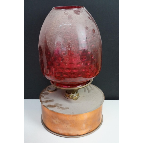 36 - Collection of Victorian oil lamps to include two large cranberry glass and clear chimney examples, t... 