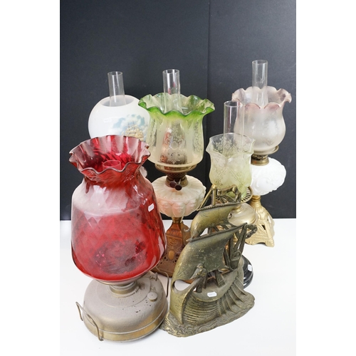 40 - Assortment of five Victorian oil lamps, three with etched coloured glass shades, one large cranberry... 