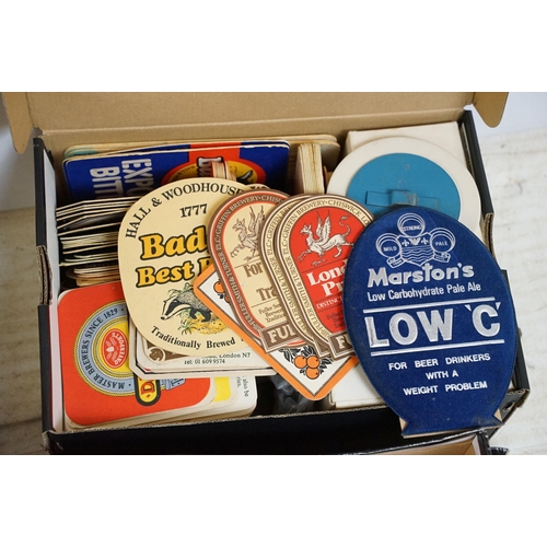 431 - Large quantity of Breweriana items to include vintage coasters, Wadworth cardboard wall clock, bar t... 