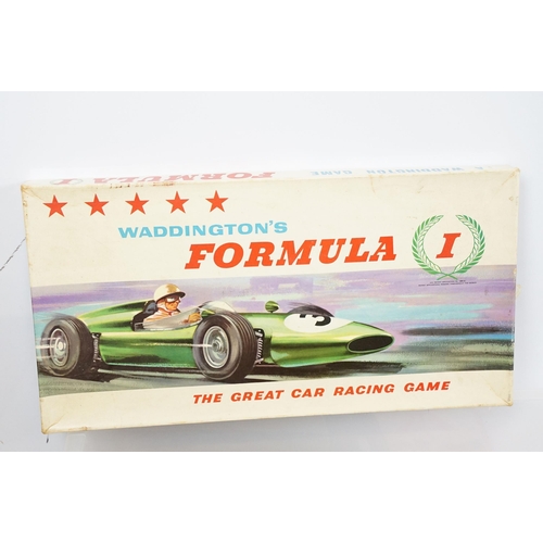 439 - Collection of vintage board games to include Waddington's Formula 1 car racing game, Totopoly, Go to... 