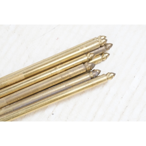 440 - Assortment of brass to include twelve stair rods and brackets, fire side utensils and fire dogs