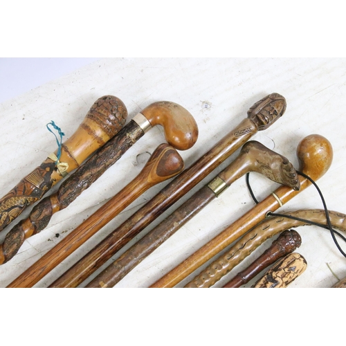 186 - Collection of assorted walking sticks and canes to include bamboo examples with root ball handles (o... 