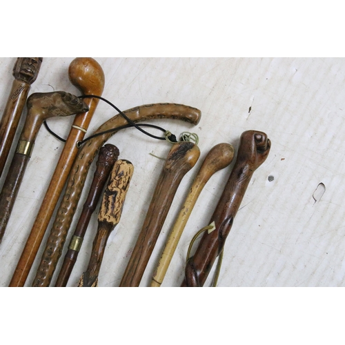 186 - Collection of assorted walking sticks and canes to include bamboo examples with root ball handles (o... 