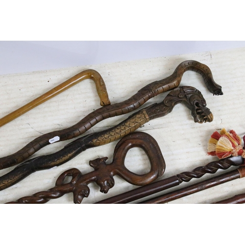 187 - Assorted collection of 20th Century walking sticks to include African carved hardwood examples, a se... 