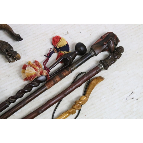 187 - Assorted collection of 20th Century walking sticks to include African carved hardwood examples, a se... 