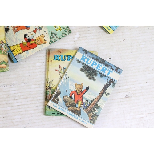 341 - A large collection of vintage Rupert the Bear annuals and books.