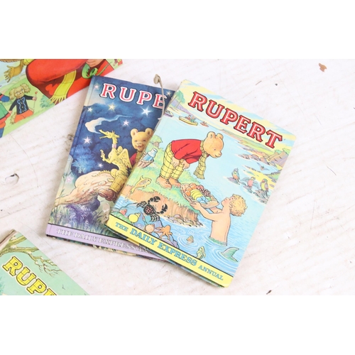 341 - A large collection of vintage Rupert the Bear annuals and books.