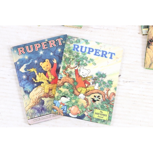 341 - A large collection of vintage Rupert the Bear annuals and books.