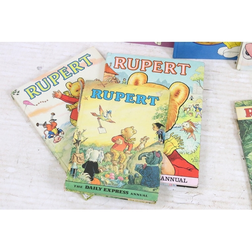 341 - A large collection of vintage Rupert the Bear annuals and books.