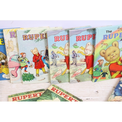 341 - A large collection of vintage Rupert the Bear annuals and books.