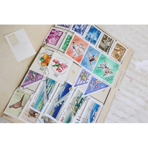 346 - A large collection of loose stamps to include British, Commonwealth and World examples to include a ... 