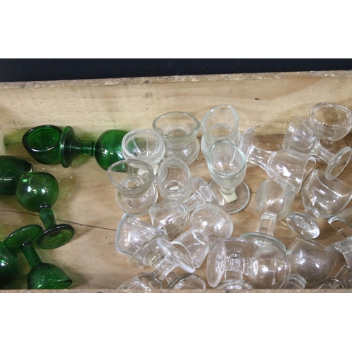 405 - Collection of optical glass eye baths to include green and clear glass examples (1box)