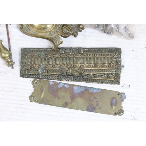 411 - Selection of brass items to include door knobs, scrolled furniture pediments, Salter hanging weighin... 