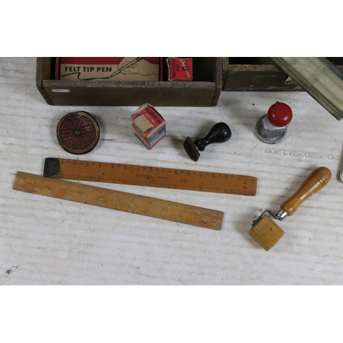 415 - Quantity of vintage writing and measuring equipment to include an assortment of rulers, carousel hol... 