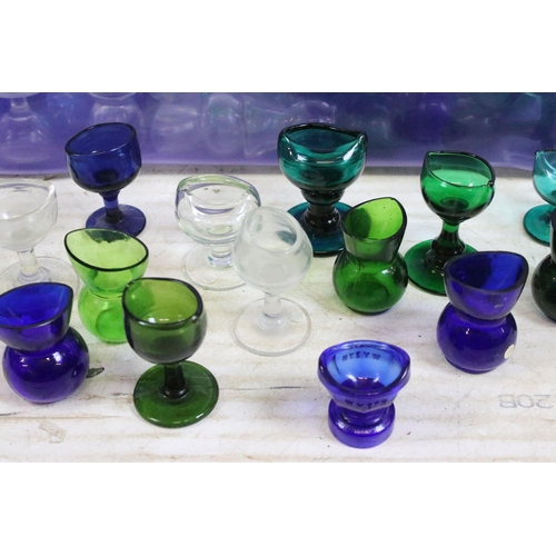 426A - Large selection of antique and vintage coloured mixed shape glass eye baths to include blue, green a... 