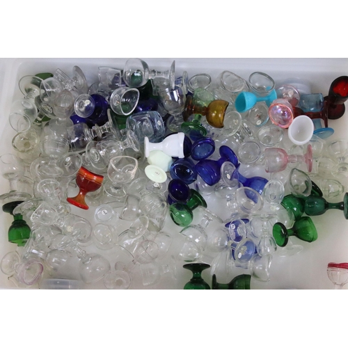 427 - Large collection of antique and vintage mixed coloured and shape glass eye baths to include milk gla... 