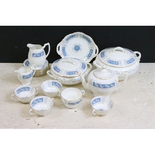 77 - Coalport 'Revelry' blue border part dinner service set to include tea pot, round serving dish, beake... 