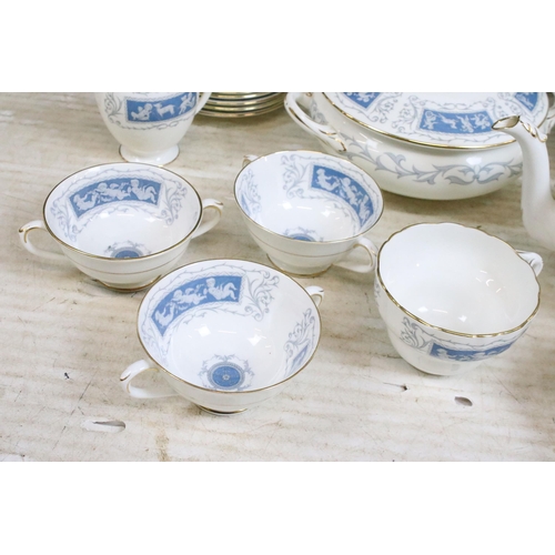 77 - Coalport 'Revelry' blue border part dinner service set to include tea pot, round serving dish, beake... 