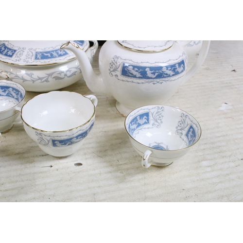 77 - Coalport 'Revelry' blue border part dinner service set to include tea pot, round serving dish, beake... 