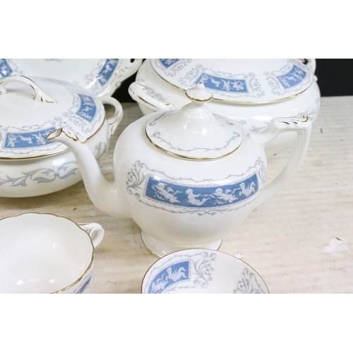 77 - Coalport 'Revelry' blue border part dinner service set to include tea pot, round serving dish, beake... 