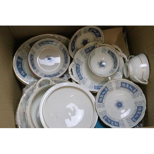 77 - Coalport 'Revelry' blue border part dinner service set to include tea pot, round serving dish, beake... 