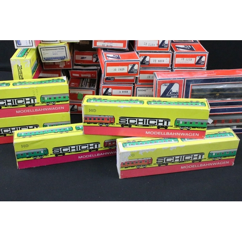 163 - 42 Boxed HO / OO gauge items of rolling stock to include 28 x Lima and 14 x Schicht, featuring coach... 