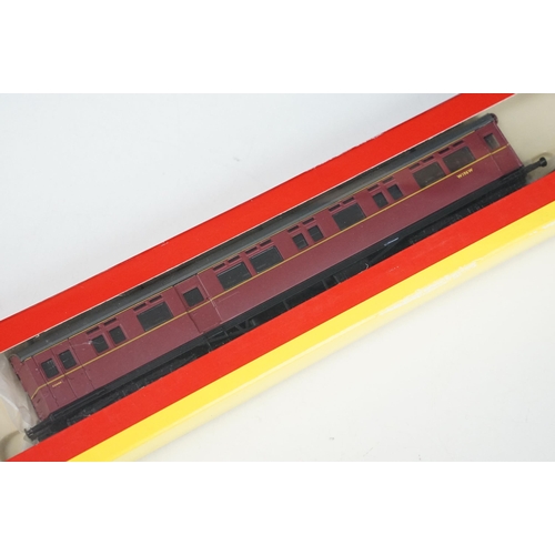 115 - Three boxed Hornby OO gauge items of rolling stock to include R4100B BR Autocoach W196W, R4100D BR A... 