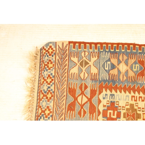 618 - 20th Century kilim rug woven with geometric design with cream ground panel to centre. Measures 97 x ... 