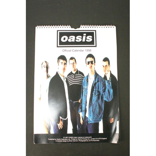 702 - Memorabilia - 3 Oasis books, a Be Here Now 1997 tour programme, and a 1998 official calendar