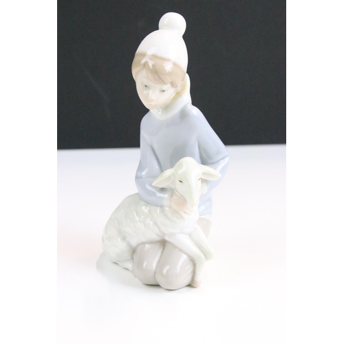 16 - Selection of Lladro figurines to include girl with lamb, girl with duck and bucket, boy in night gow... 