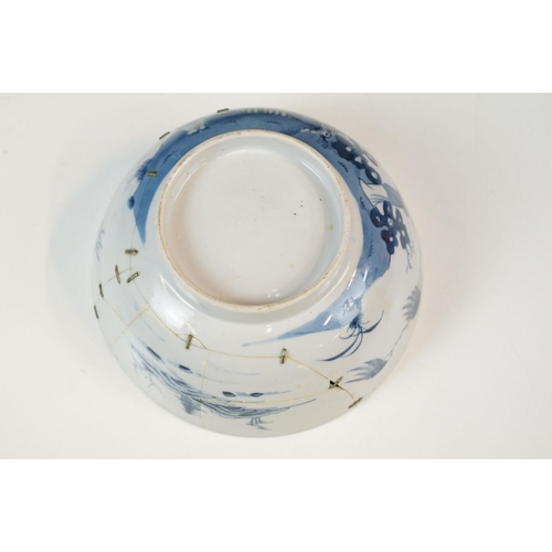 19 - Two Chinese Qing dynasty bowls to include a blue and white painted bowl depicting figures in a garde... 