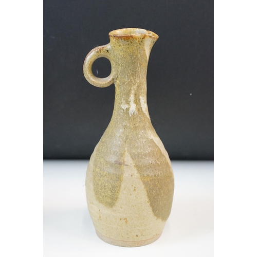 25 - Tang Dynasty painted figure H 23cm together with a pottery patterned pitcher jug H 24cm