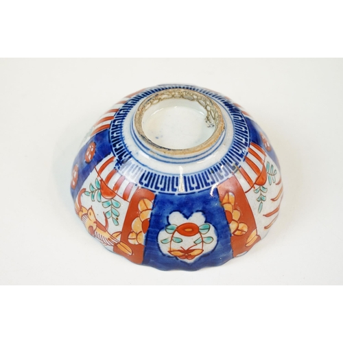 26 - Group of Japanese blue and red Imari five bowls and plate, smallest 13cm diameter, plate 21.5cm diam... 