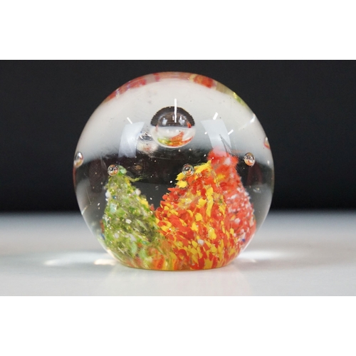 40 - Mixed shape coloured glass paperweights to include floral and millefiori examples, 8 total