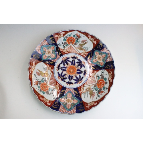 52 - Large Japanese Imari pattern scalloped plates, hand painted with gilt detail, 30cm diameter (one dam... 